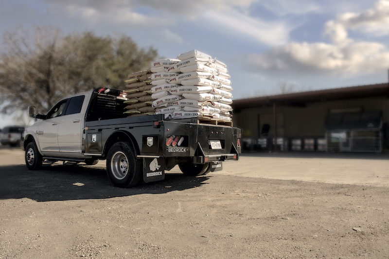 Pickup with utility truck bed hauling load